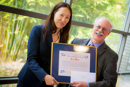 Professor Nancy Kwak receiving an award