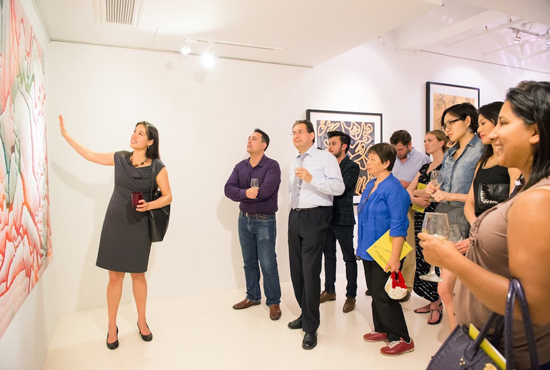 Tiffany Wai-Ying Beres showing art in a gallery, with audience
