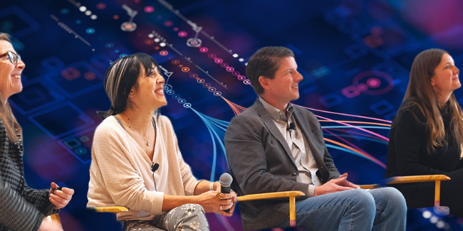 People sit in chairs on a panel